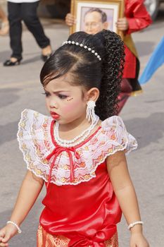 CHIYA, SURATTHANEE - JULY 13 : The unidentified Thai school children are performing their outdoor in Dogbua game parade on July 13, 2012 at Chiya, Surathanee, Thailand.