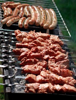 Meat cooking on barbeque grill