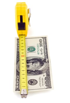 Measure tape on hundred dollar banknote isolated on white