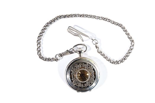 Closed vintage pocket watch on the white background.