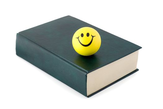 Green book with Smiley isolated on white background