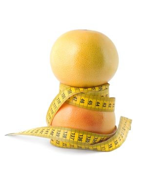 grapefruit and measuring tape dieting concept isolated on white background