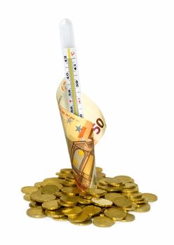 Coins and thermometer isolated on white background