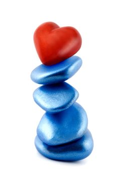 red heart in stone balance concepts isolated on white background