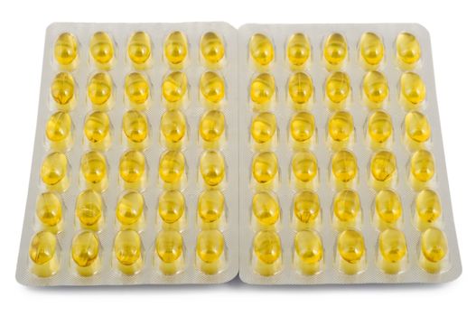 yellow capsules with fish oil isolated on white background
