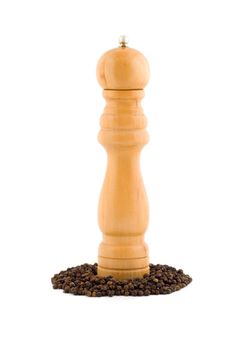 Wooden pepper mill , isolated on white background.