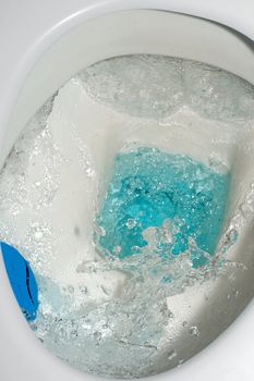 Toilet from above,drip drop bubble splash wasting water