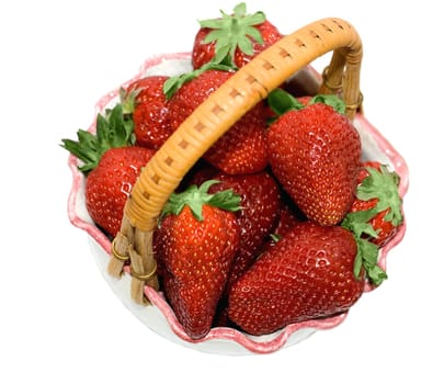 strawberries in basket close-up isolated on white background