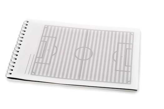 soccer field in spiral note pad , isolated on white background