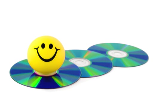 smiles on dvd disk computer close-up isolated on white background