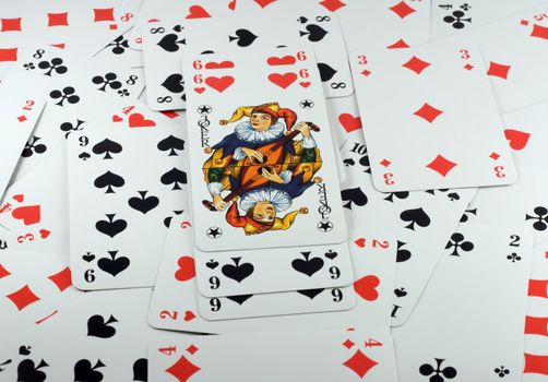 Poker cards background, with six beside Joker.