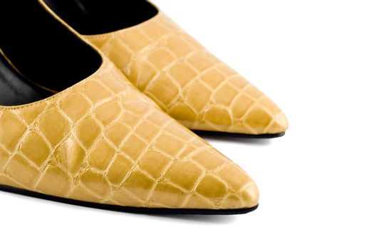 gold leather shoes , close-up isolated on white background