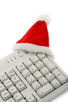 santa claus hat in keyboard isolated on white background