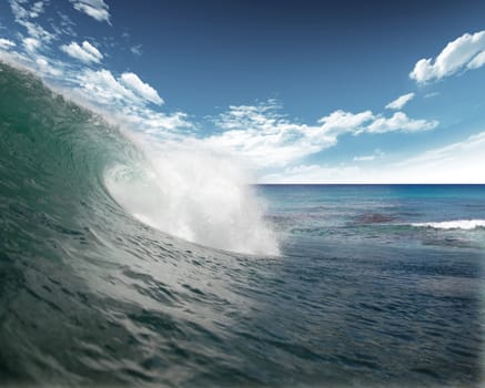 Wave in the Atlantic Ocean with blue sky and clouds in the background