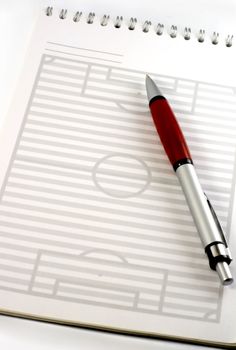 red pen and pad is strategy football field