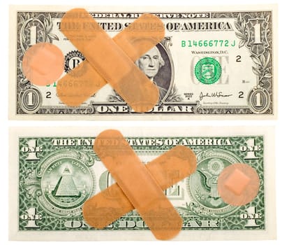 one dollar with band-aid close-up , isolated on white background
