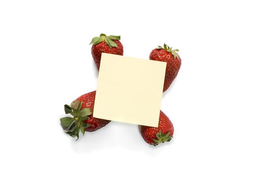 Note paper on strawberries,isolated on a white background