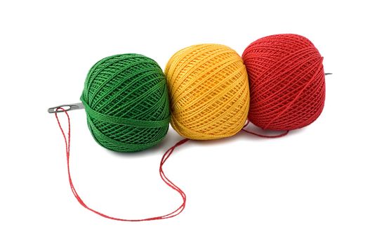 needle in embroidery threads isolated on white background.