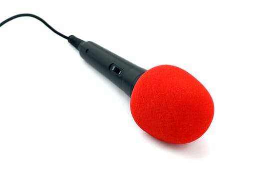 Microphone black in red close-up isolated on white background
