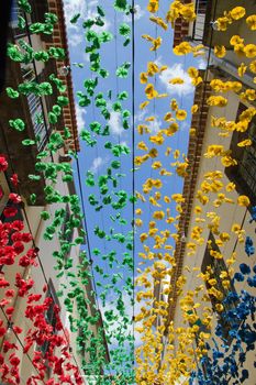 Religious holiday in Funchal, street decorated with colorful garlands  Madeira