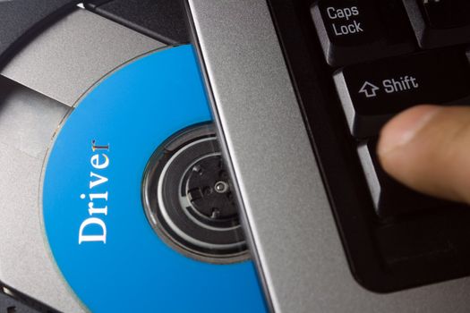 Laptop with open CD holder , driver disc