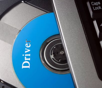 Laptop with open CD holder , driver disc