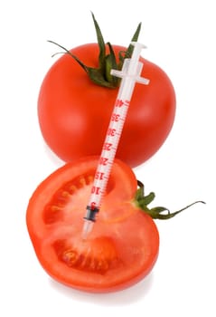 insulin syringe in tomatoes isolated on white background