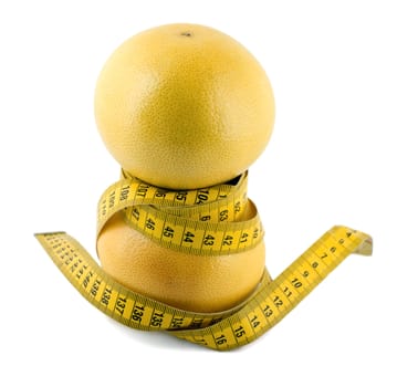 grapefruit with measuring tape over white background