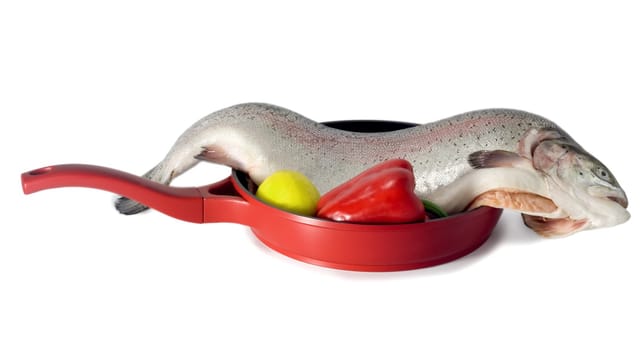 Fresh red salmon fish on frying pan isolated on white background