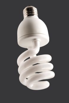 fluorescent energy saving lamp isolated on gray background