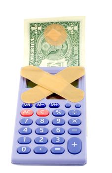 Financial crisis concepts , band-aid calculator dollars . isolated on white background