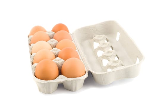 eggs in protective case foreground close-up isolated on white background