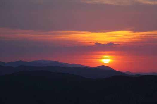 Summer landscape in mountains with the sun