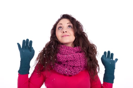 beautiful smiling brunette woman in snow in winter  isolated on white background