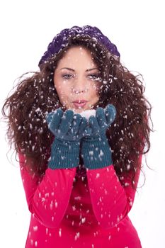 beautiful smiling brunette woman in snow in winter  isolated on white background