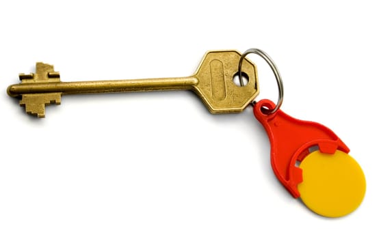 Isolated bronze Key with red key ring for coins On White background