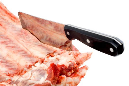 axe butcher in raw meat close-up isolated on white background