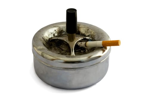 Ashtray and cigarette close-up,isolated on a white background.