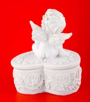 angel isolated on red background