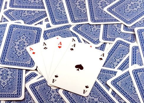 Four Aces in Background scattered Playing Card Back .