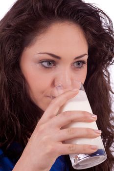beautiful smiling woman is drinking milk isolated on white background