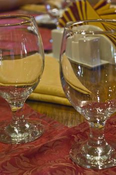 Glasses on a table in evening cafe waiting