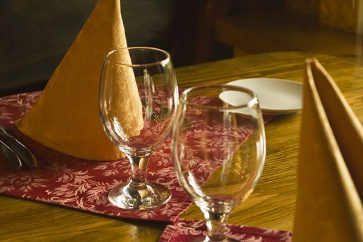 Glasses on a table in evening cafe waiting