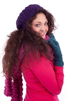 beautiful young smiling girl with hat and scarf in winter isolated on white background