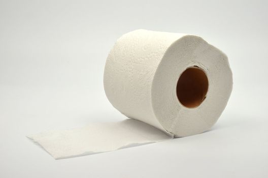 Simple toilet paper on gray background