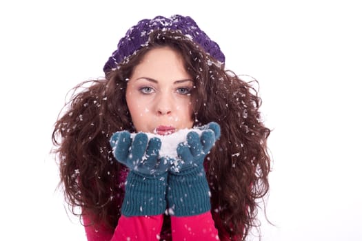 beautiful smiling brunette woman in snow in winter  isolated on white background