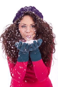 beautiful smiling brunette woman in snow in winter  isolated on white background