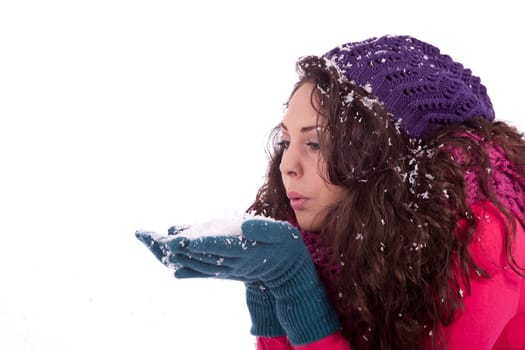 beautiful smiling brunette woman in snow in winter  isolated on white background