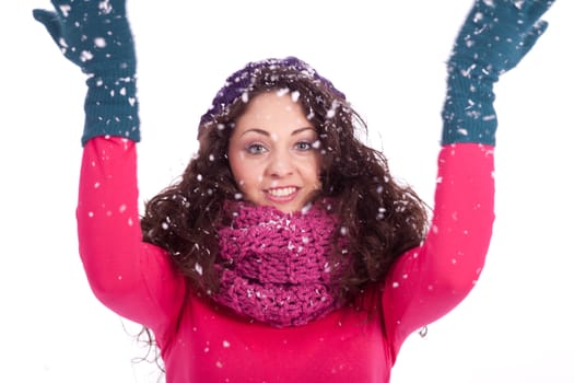 beautiful smiling brunette woman in snow in winter  isolated on white background