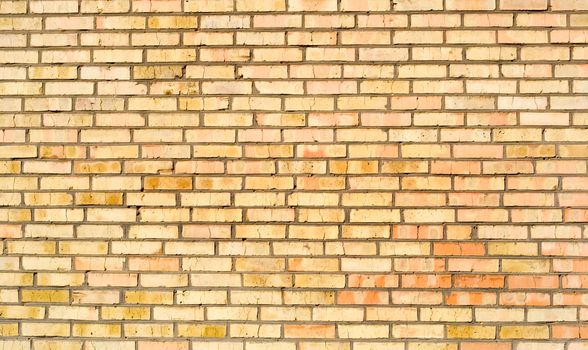 Yellow red brick wall background. Many old bricks .
